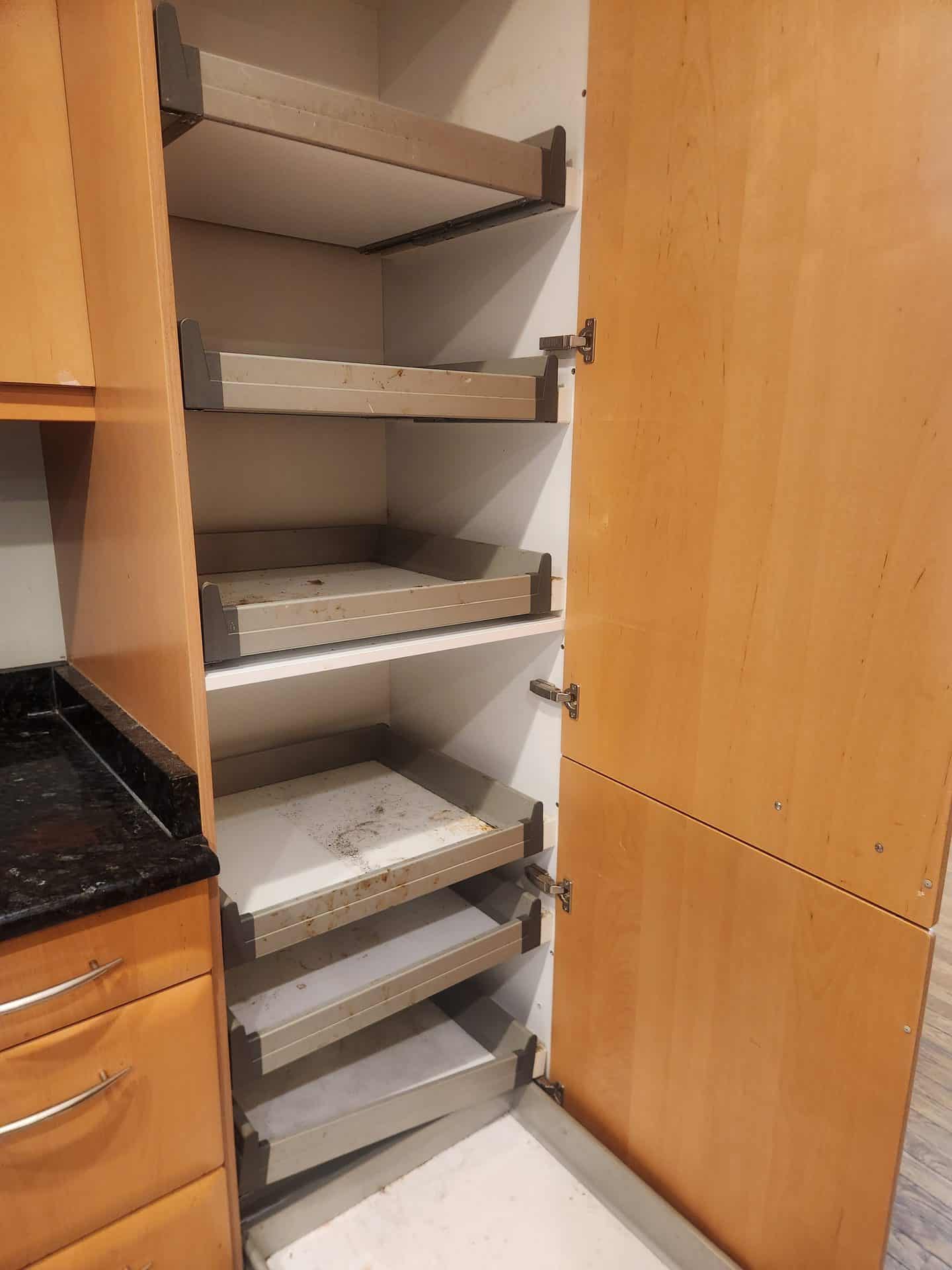 Kitchen cabinets before move-out cleaning in Chesterland