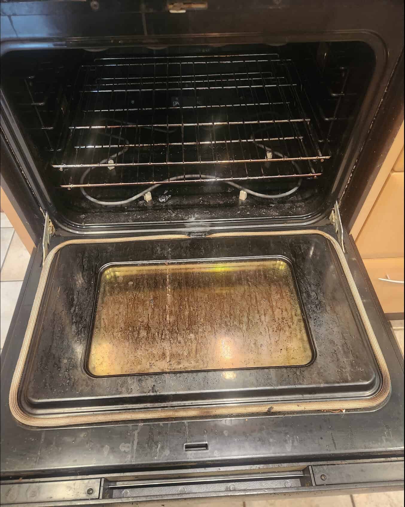 Dirty oven before move-out cleaning in Chesterland